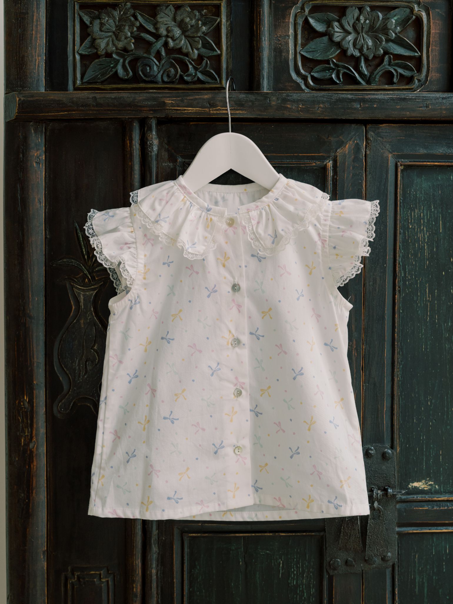 Nicky Hilton x La Coqueta Ivory Bow Olivia Girl Shirt