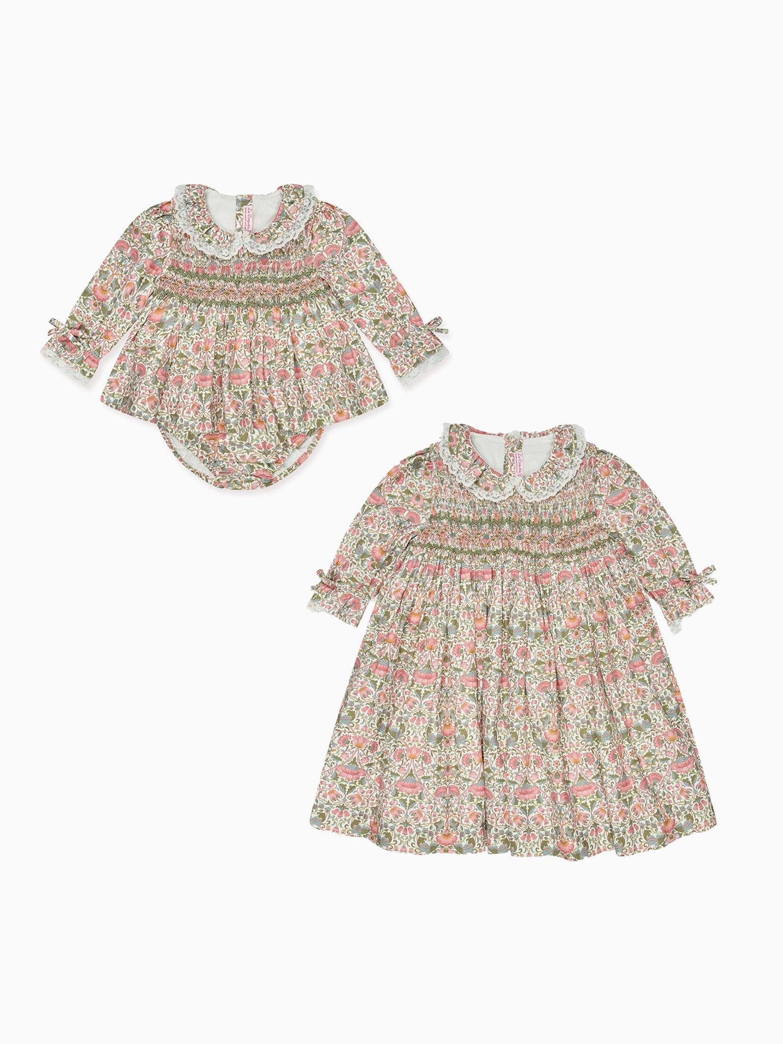 Elegant baby clothing set in floral print, featuring a smocked dress with lace collar and matching romper with long sleeves.