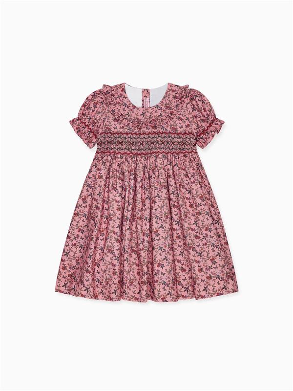 Elegant pink floral child's dress with short ruffled sleeves and smocked bodice, perfect for special occasions.