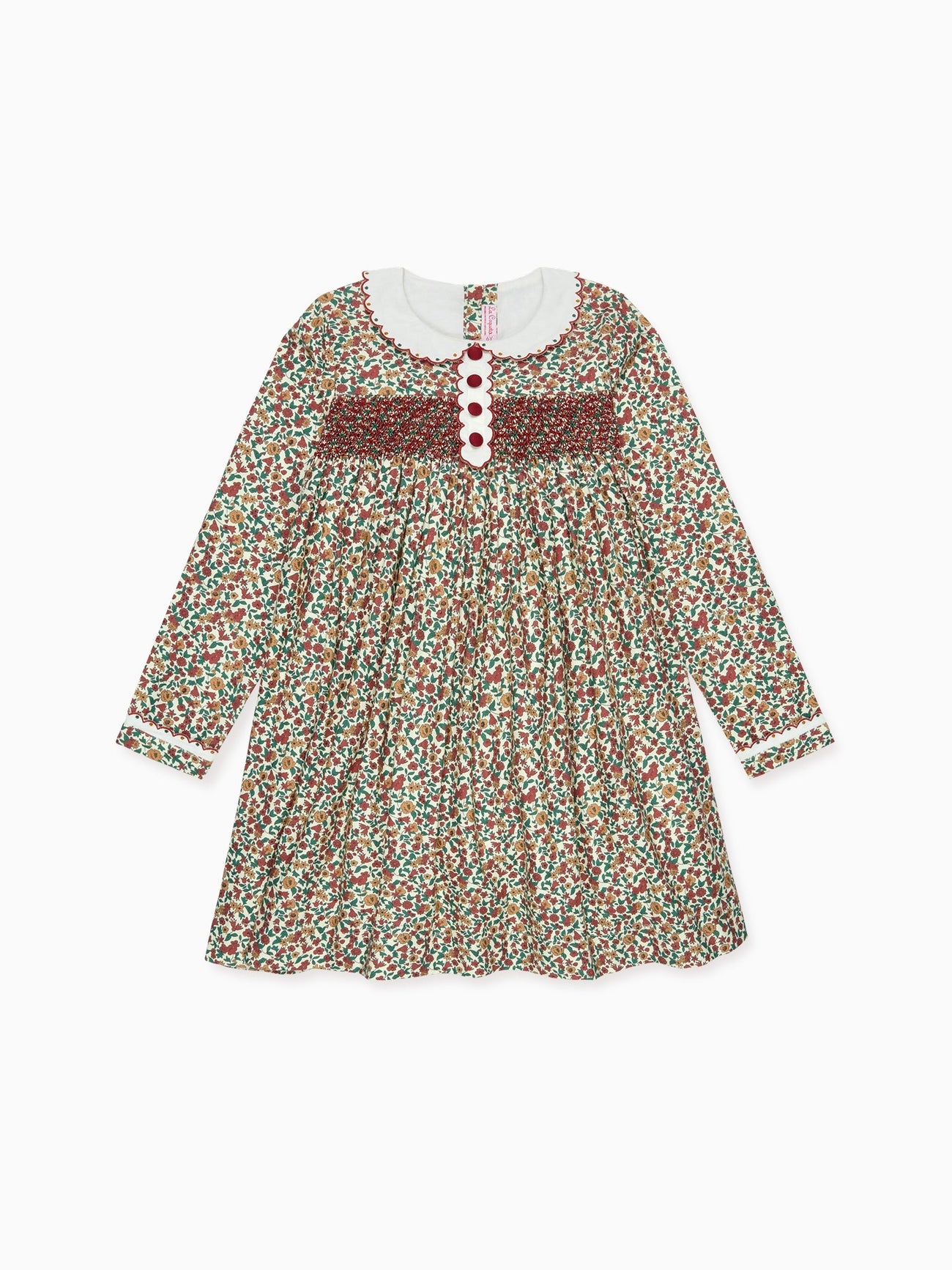A charming floral patterned children's dress in vibrant red, green, and brown hues, featuring a white Peter Pan collar.